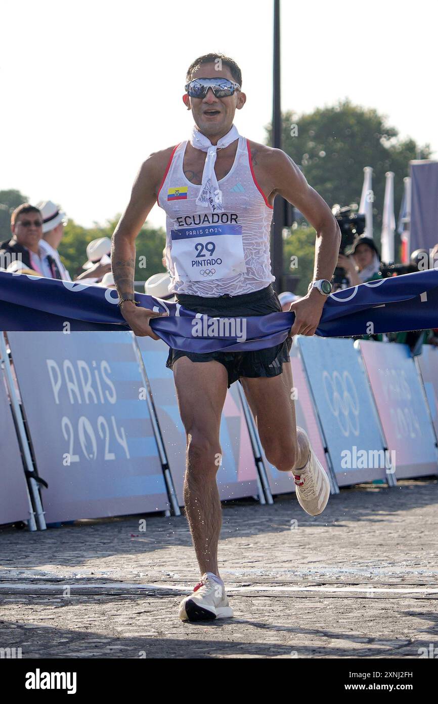 Brian Daniel Pintado, of Ecuador, crosses the finish line to win the ...