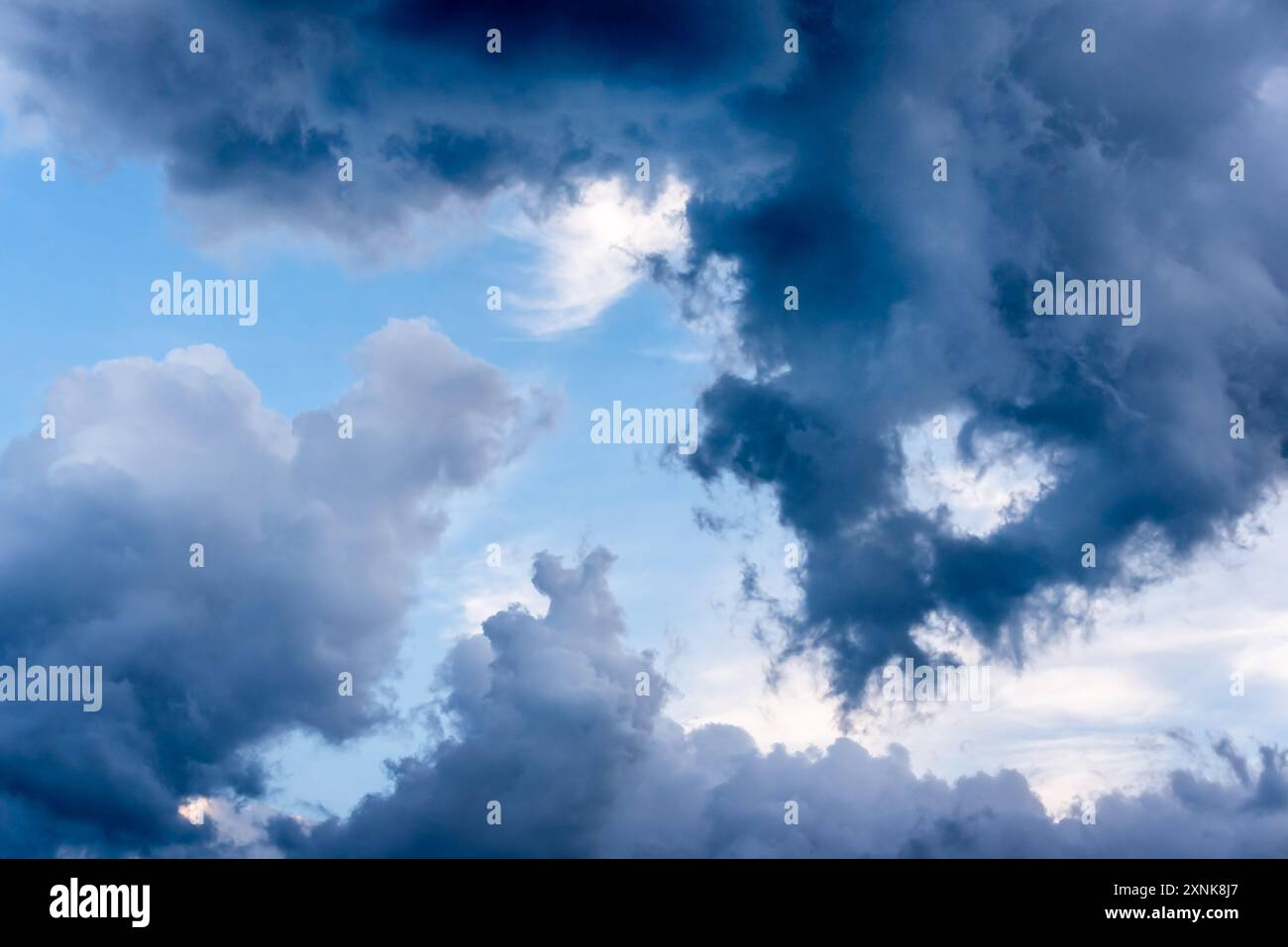 Dark and Dramatic Storm Clouds framing a clear sky Area Background ...
