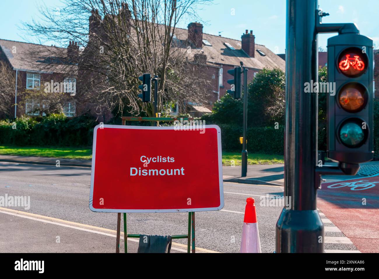 Traffic light for pedestrian and cyclists and q-sign cyclist dismount Stock Photo