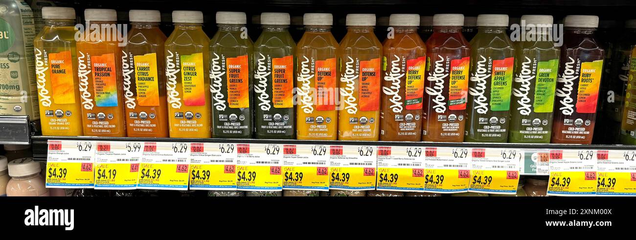 Bottles of organic juice blends by Evolution Fresh for sale at Whole Foods. Stock Photo