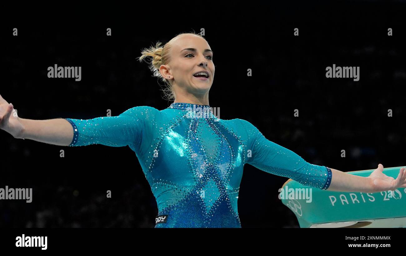 Alice D'Amato, of Italy, celebrates after performing on the vault ...