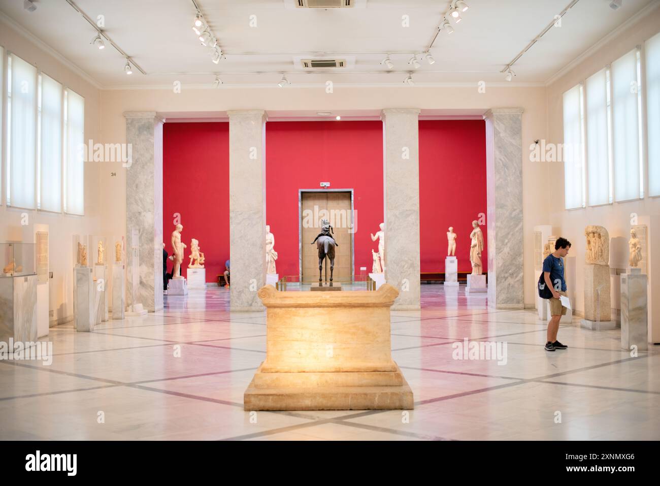 National Archaeological Museum Ancient Greek Sculptures Athens // ATHENS, Greece — The National Archaeological Museum in Athens hosts an extensive array of sculptures and statues, representing some of the finest examples of ancient Greek art. The museum's collection spans several historical periods, including the Archaic, Classical, and Hellenistic eras, showcasing the evolution of Greek sculpture through centuries. Visitors can admire iconic works such as the Aphrodite of Arles and the Kouros statues, which reflect the artistic excellence and cultural heritage of ancient Greece. Stock Photo