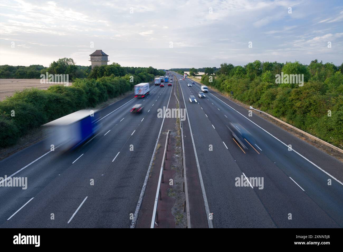 The M40 motorway between junction 9 and 10 near Bicester, Banbury and Oxford, showing cars, trucks and coaches driving on it, Oxfordshire Stock Photo