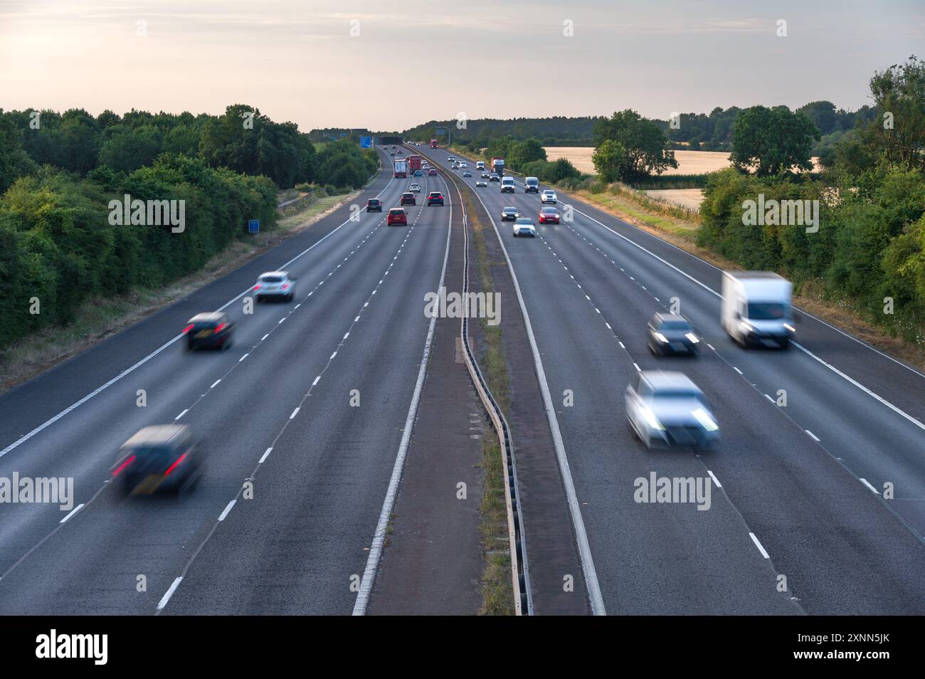 The M40 motorway between junction 9 and 10 near Bicester, Banbury and Oxford, showing cars, trucks and coaches driving on it, Oxfordshire Stock Photo