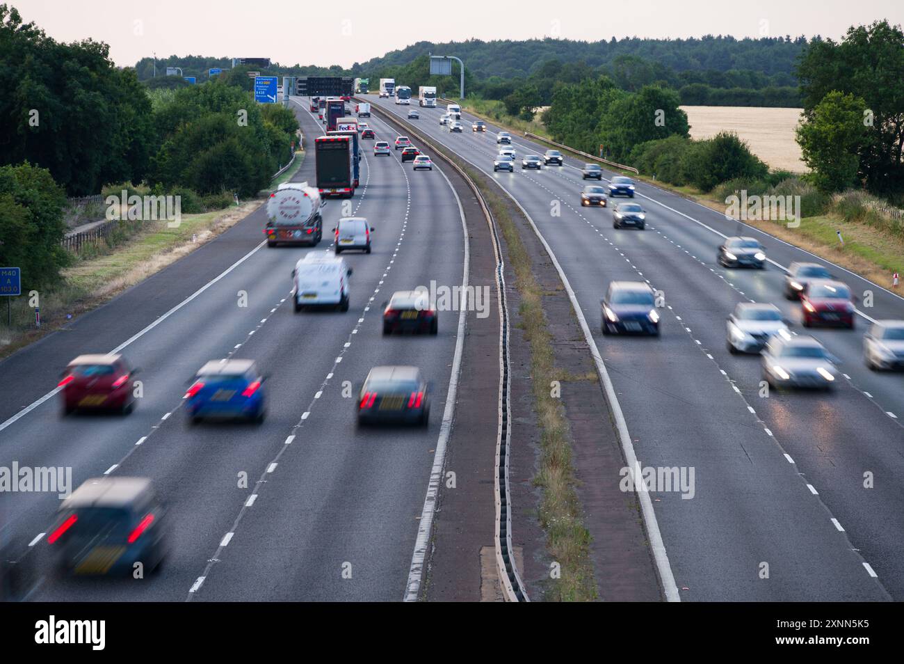 The M40 motorway between junction 9 and 10 near Bicester, Banbury and Oxford, showing cars, trucks and coaches driving on it, Oxfordshire Stock Photo