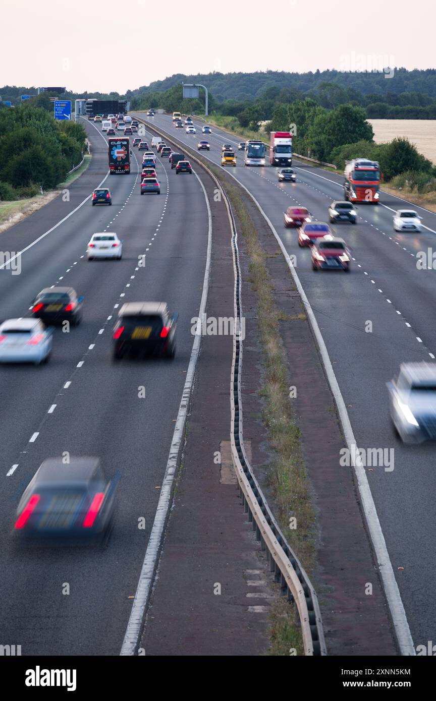 The M40 motorway between junction 9 and 10 near Bicester, Banbury and Oxford, showing cars, trucks and coaches driving on it, Oxfordshire Stock Photo