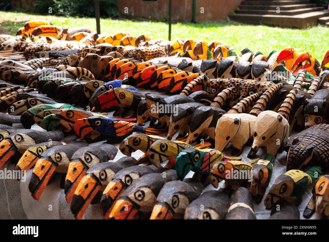 Displayed A vibrant collection of handcrafted wooden animal figures displayed at ...
