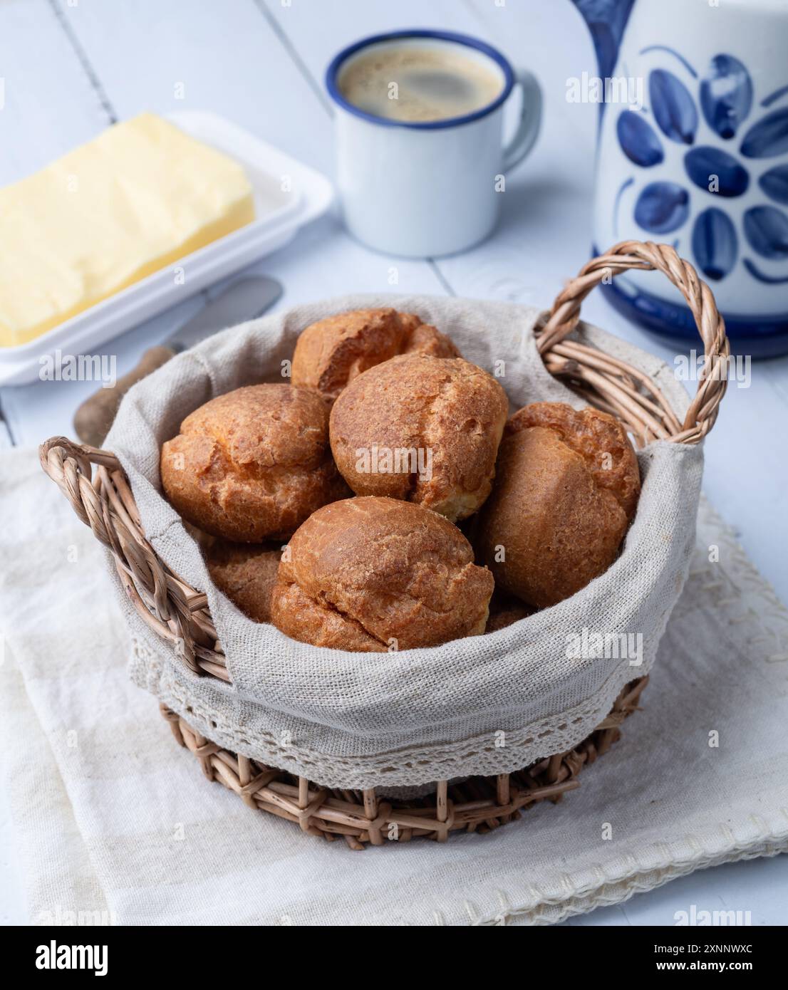 Broa, typical brazilian corn flour bread with butter and coffee. Stock Photo