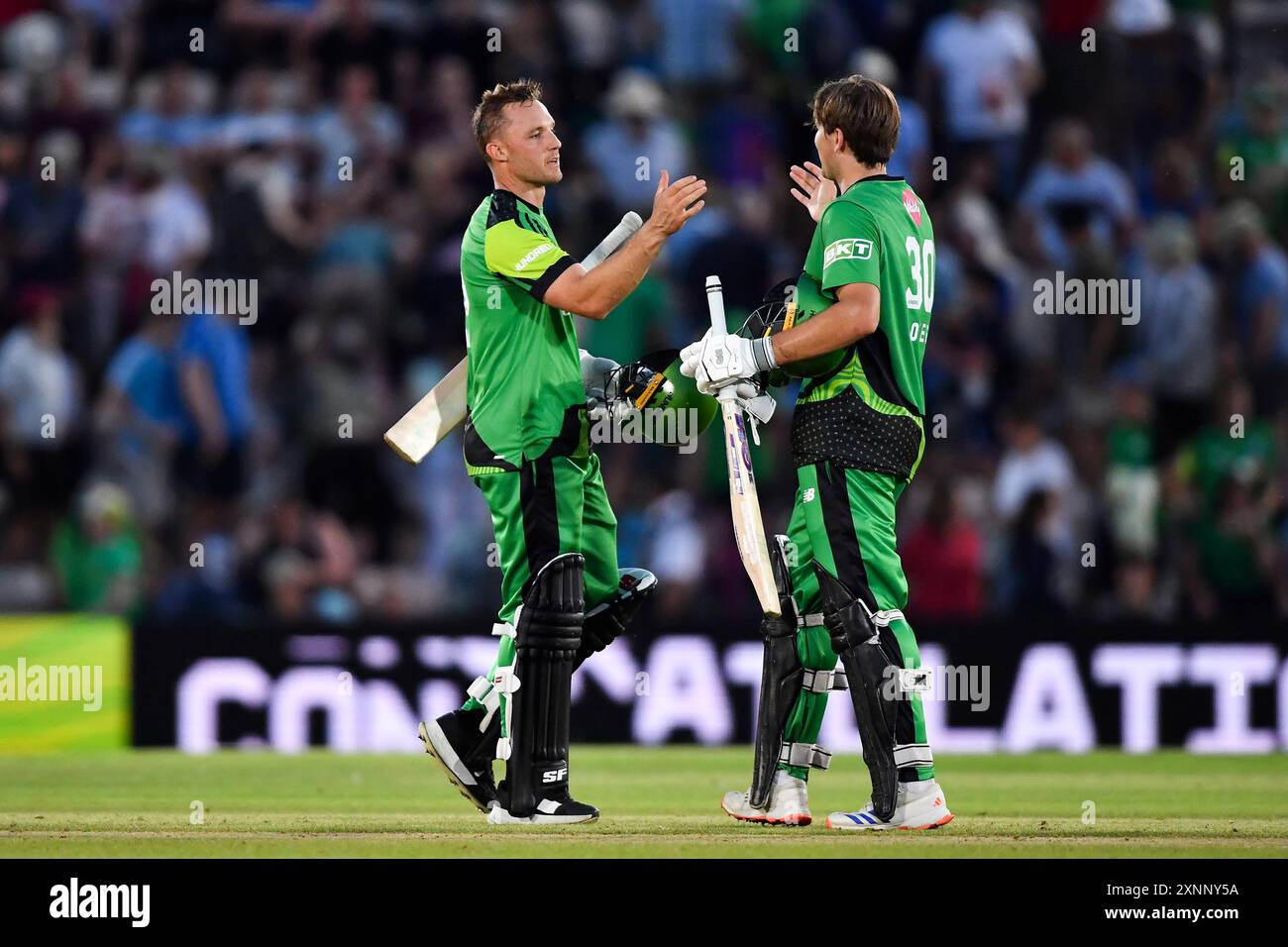 Southampton, UK. 01 August 2024. Laurie Evans (left) and James Coles of Southern Brave after securing the victory during The Hundred Men's match between Southern Brave and Manchester Originals at Utilita Bowl. Credit: Dave Vokes/Alamy Live News Stock Photo