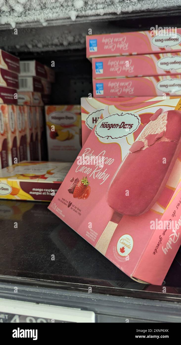 A display of Haagen-Dazs ice cream in a freezer fridge at Superstore. Stock Photo