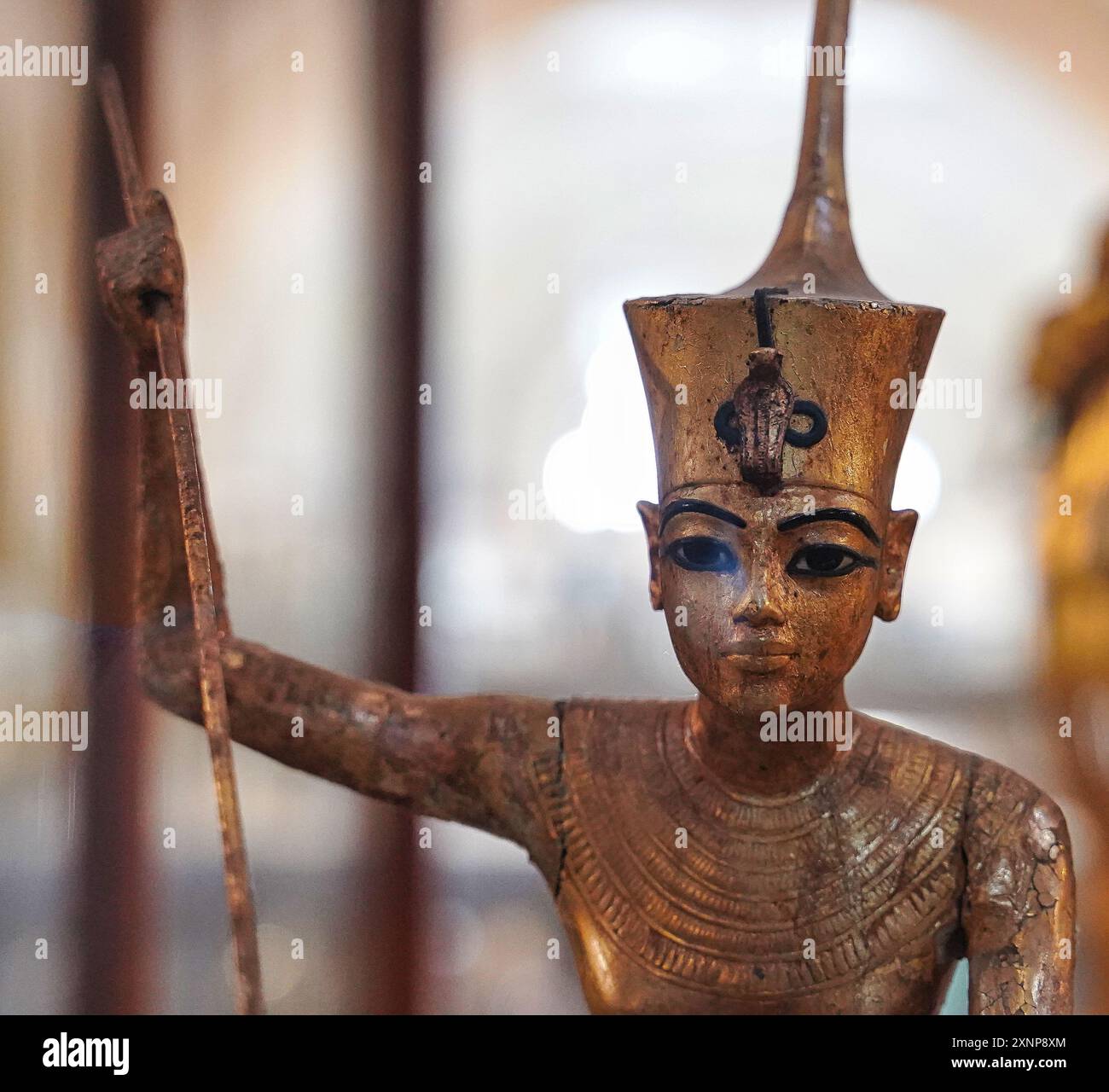 Cairo,Egypt,December 31,2019-Close up of a golden statuette of Tutankhamun in an attacking pose with glass inlay from the Tomb of Tutankhamun,KV62 at the Museum of Egyptian antiquities in Cairo,Egypt Stock Photo