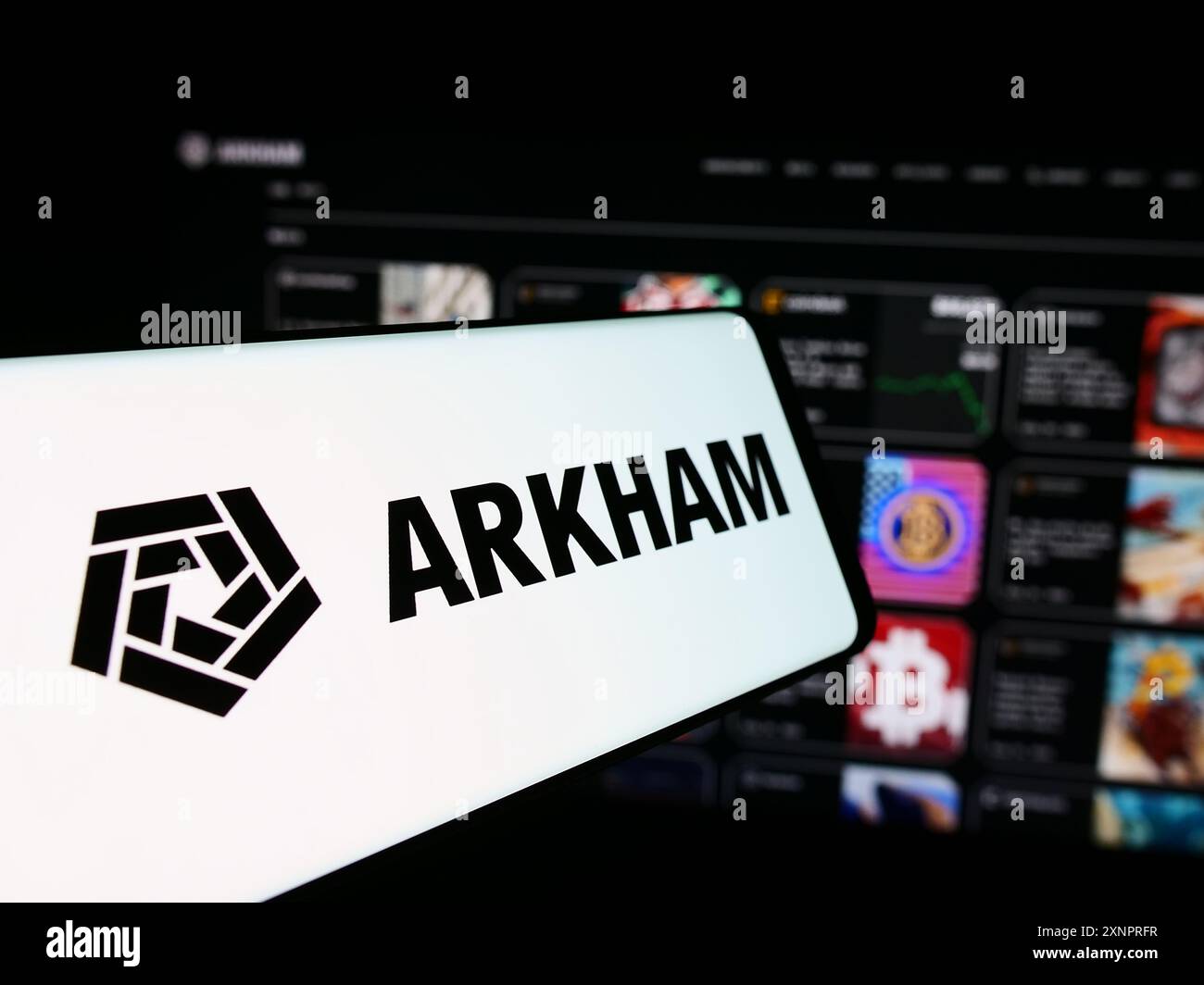Cellphone with logo of American blockchain company Arkham Intelligence Inc.  in front of business website. Focus on center of phone display Stock Photo  - Alamy