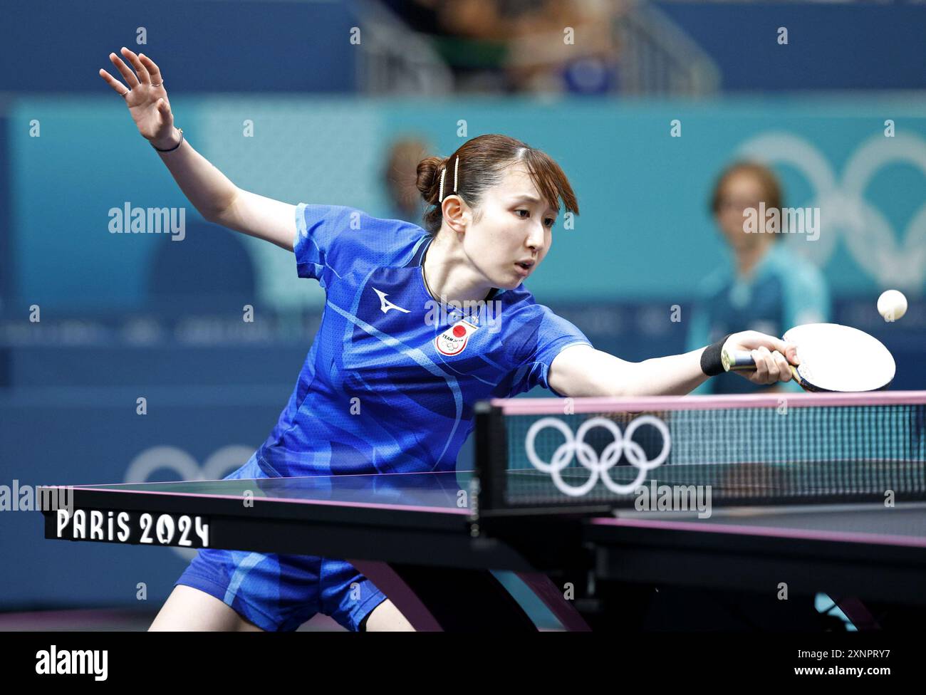 Japan's Hina Hayata plays against North Korea's Pyon Song Gyong in the