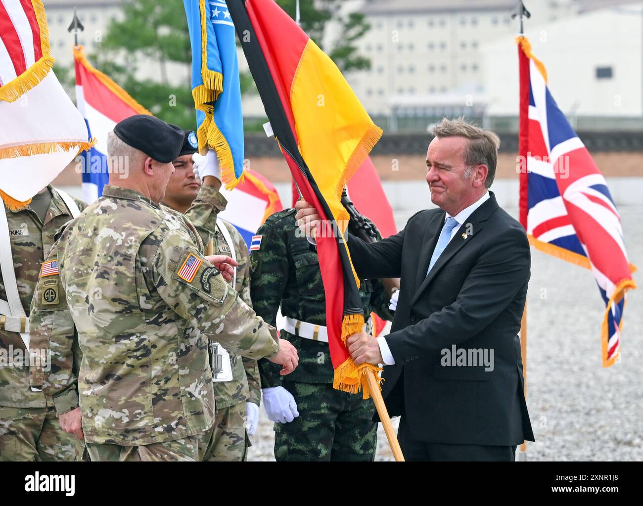 Pyeongtaek, South Korea. 02nd Aug, 2024. Defense Minister Boris Pistorius (r, SPD) and General Paul J. LaCamera (l, USA), Commander of the United Nations Command (UNC) hand over the German flag to a soldier at the US base Camp Humphreys. Germany is now a member of the UNC. The German SPD politician visits political partners in the geostrategically important Indo-Pacific region. Credit: Soeren Stache/dpa/Alamy Live News Stock Photo