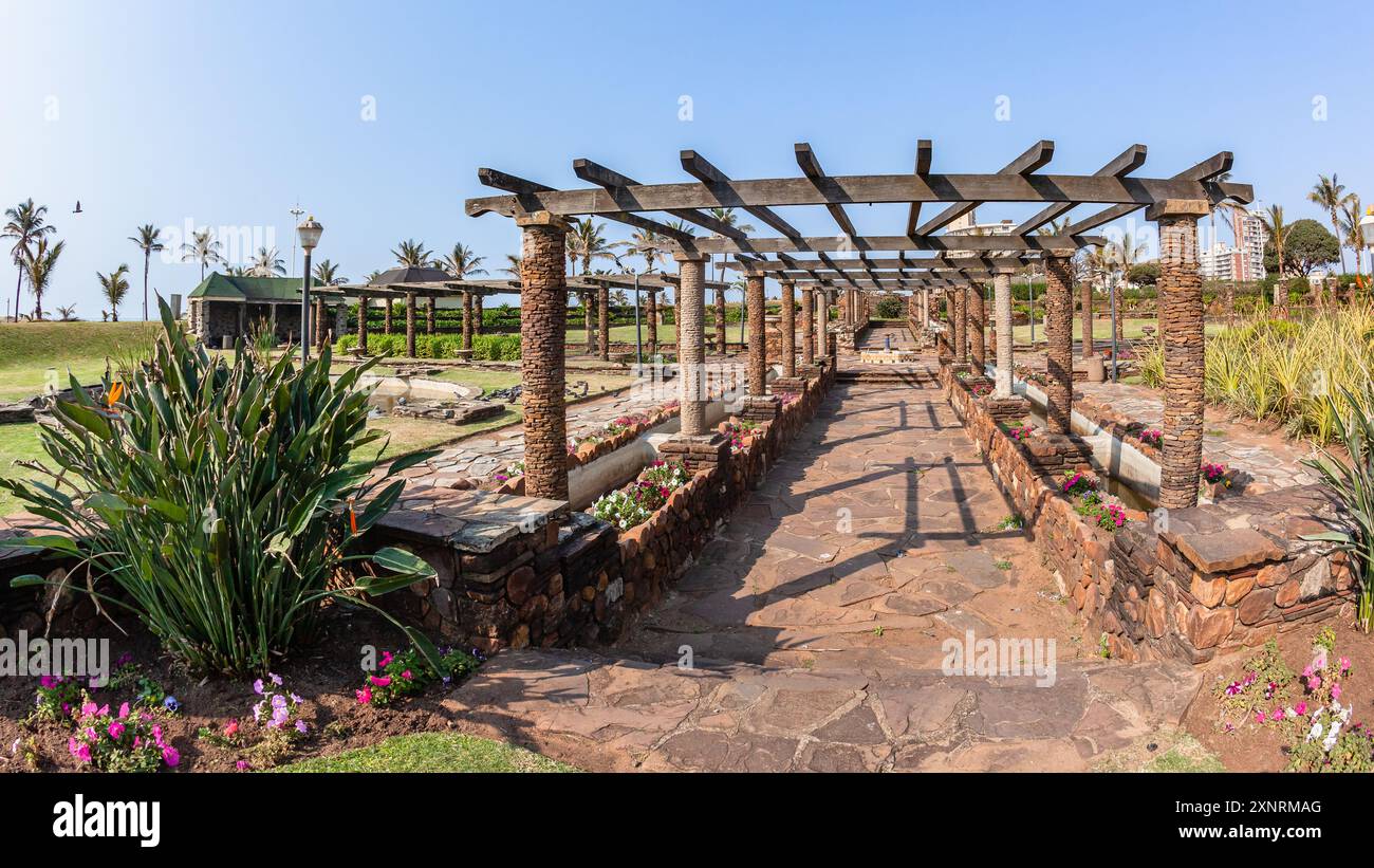 Overlooking botanical gardens well manicured maintained  plants flowers and grass structures landscape along Durban's beach ocean sea coastline landsc Stock Photo