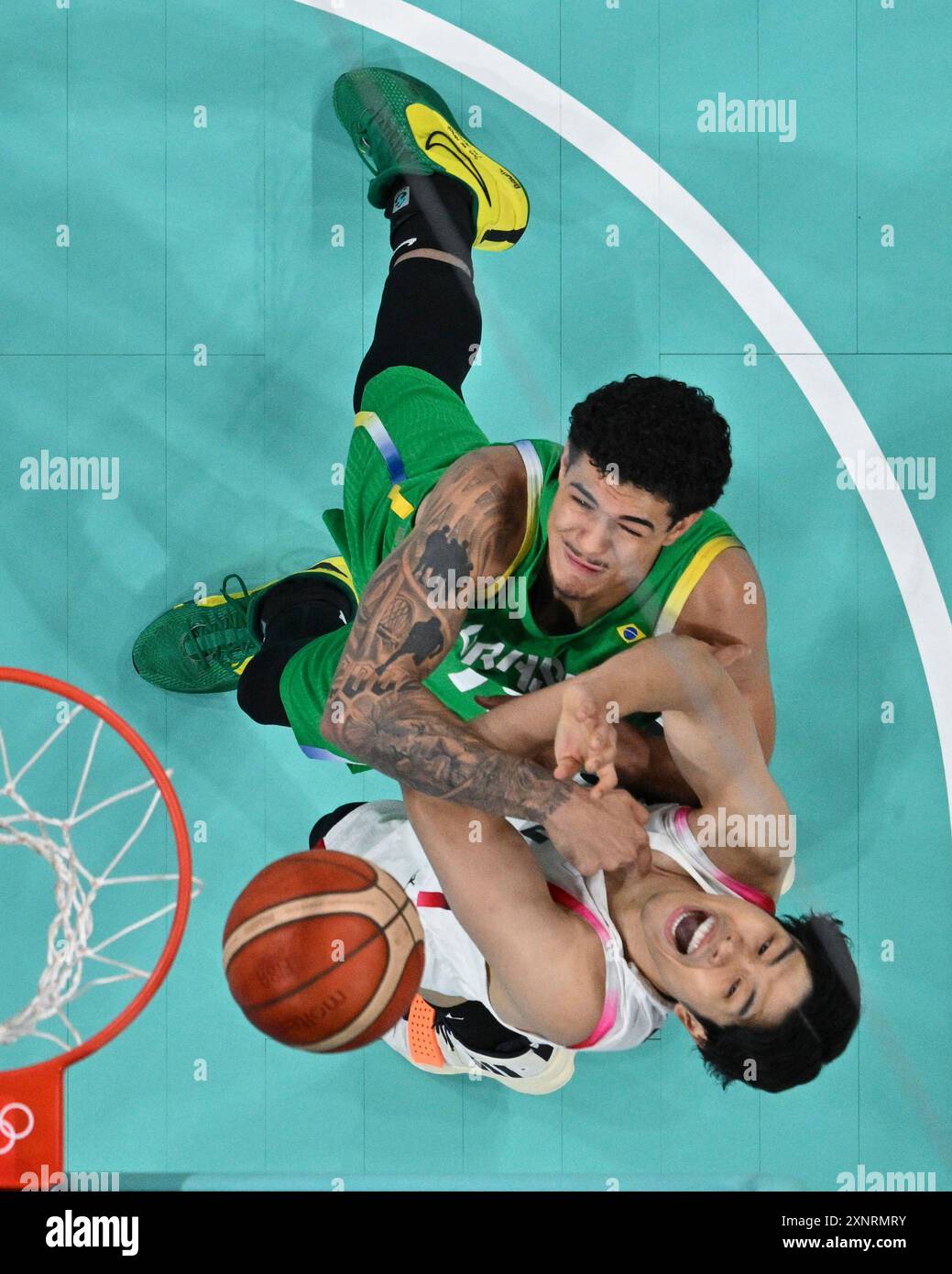 Gui Santos, of Brazil, top, battles with Hirotaka Yoshii, of Japan, for