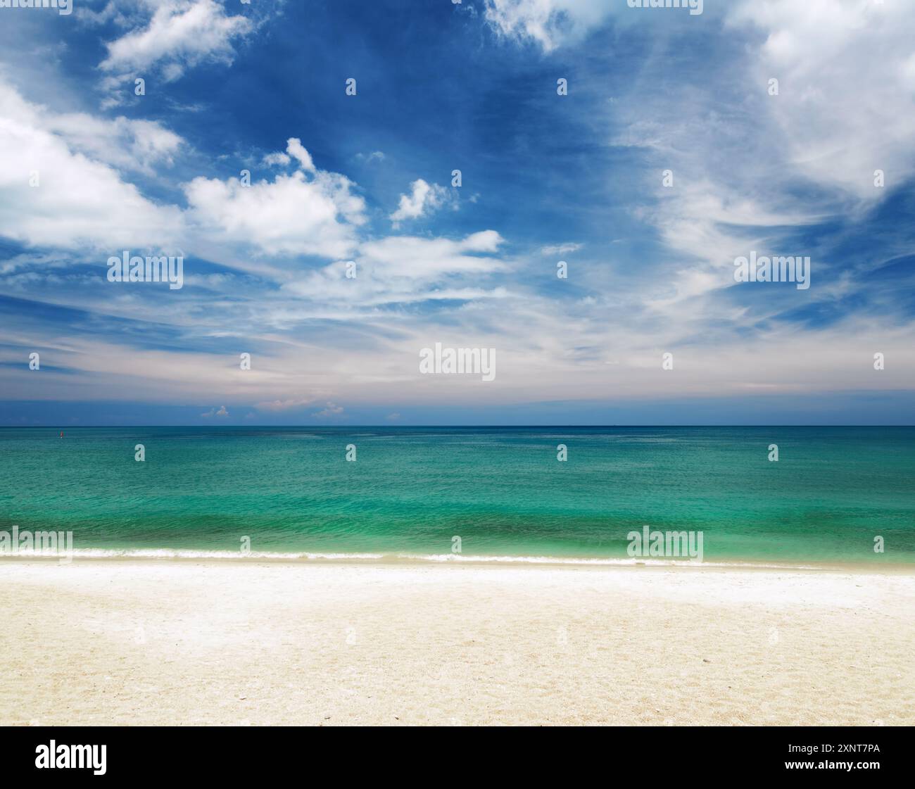Clear water and blue sky. White sand beach Stock Photo - Alamy
