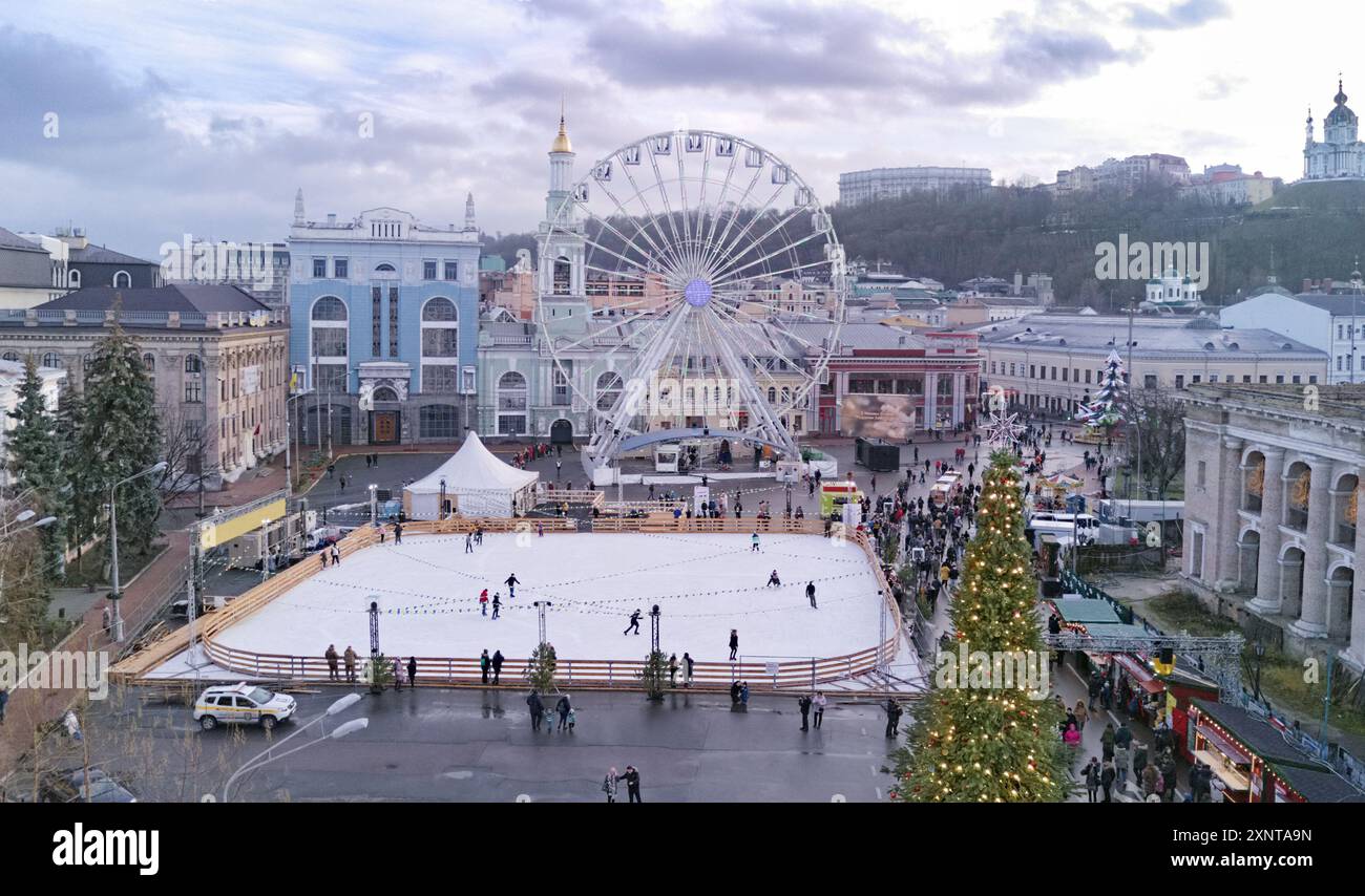Aerial view of Christmas market Kyiv, Ukraine. Ferris wheel, ice rink ...