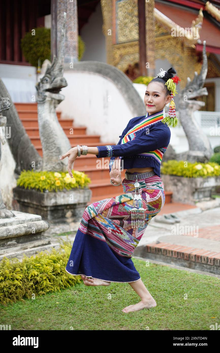 Asian women wearing Lanna dress Traditional Costume in a Chiang Mai temple  Stock Photo
