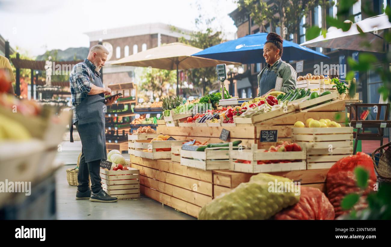 Black man selling vegetables hi-res stock photography and images - Alamy