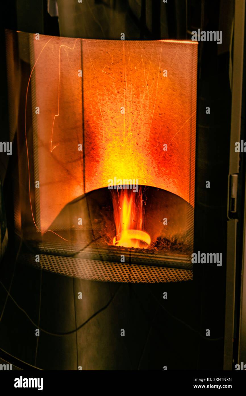 Pellet stove burning with flame in a living room Stock Photo - Alamy