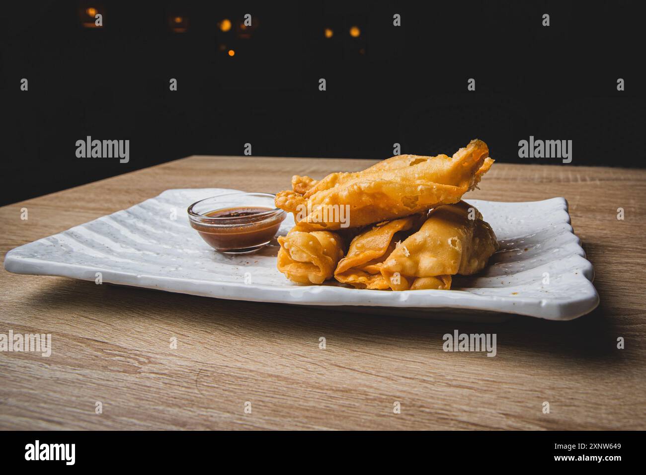Gourmet fried spring rolls on a restaurant table. Stock Photo