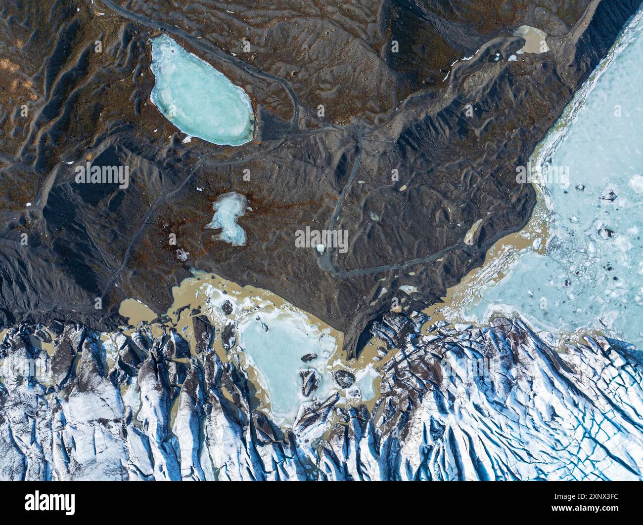 Aerial drone view of particular ice textures formed in the Svinafellsjokull glacier following global warming, Iceland, Polar Regions Stock Photo
