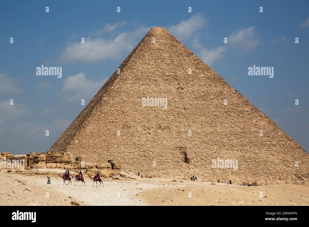 Tourists on Camels, Pyramid of Khafre (Chephren) in the background, Giza Pyramid Complex, UNESCO World Heritage Site, Giza, Egypt, North Africa Stock Photo