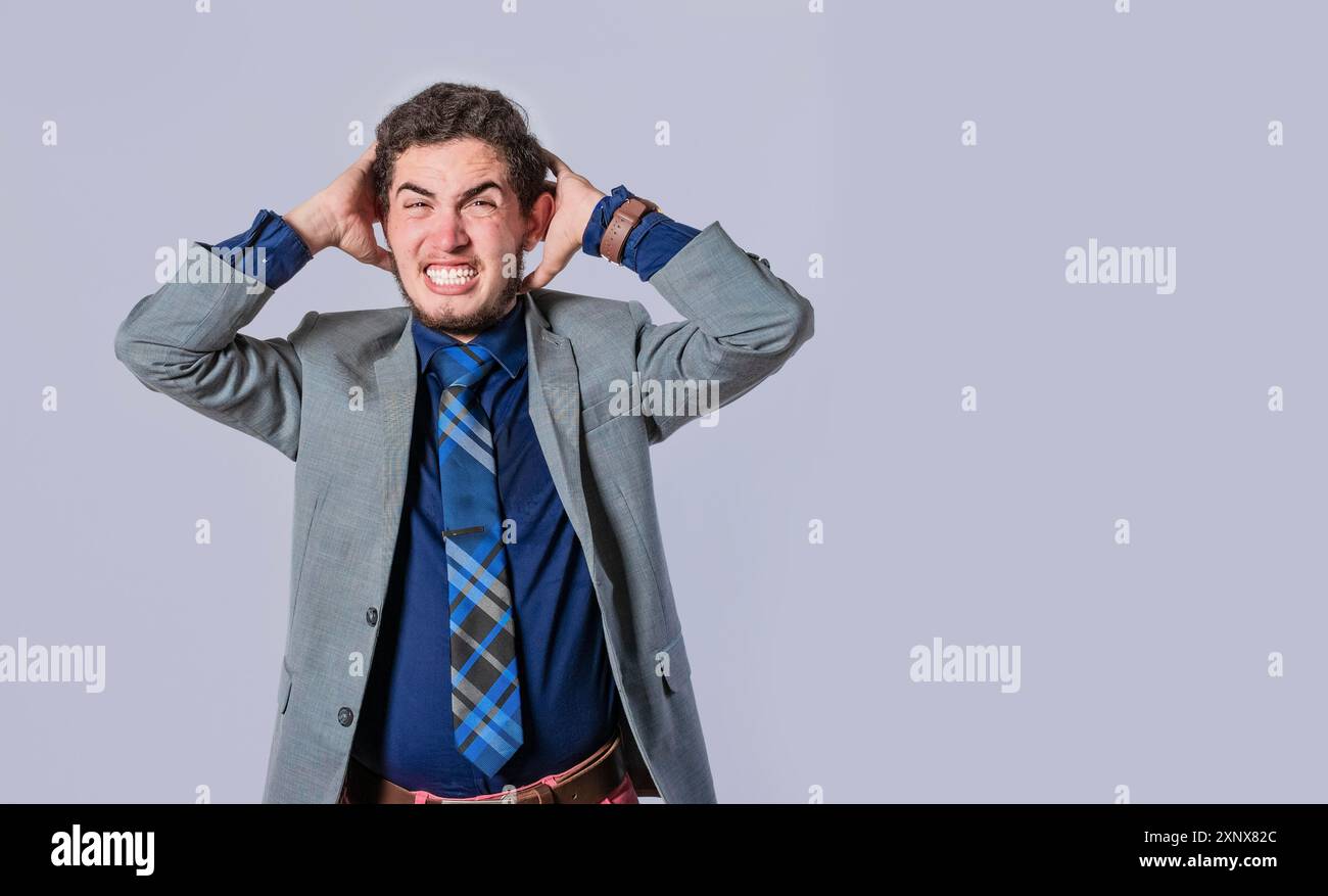 Frustrated businessman yelling, Man in suit screaming clutching his head, Desperate man yelling isolated Stock Photo