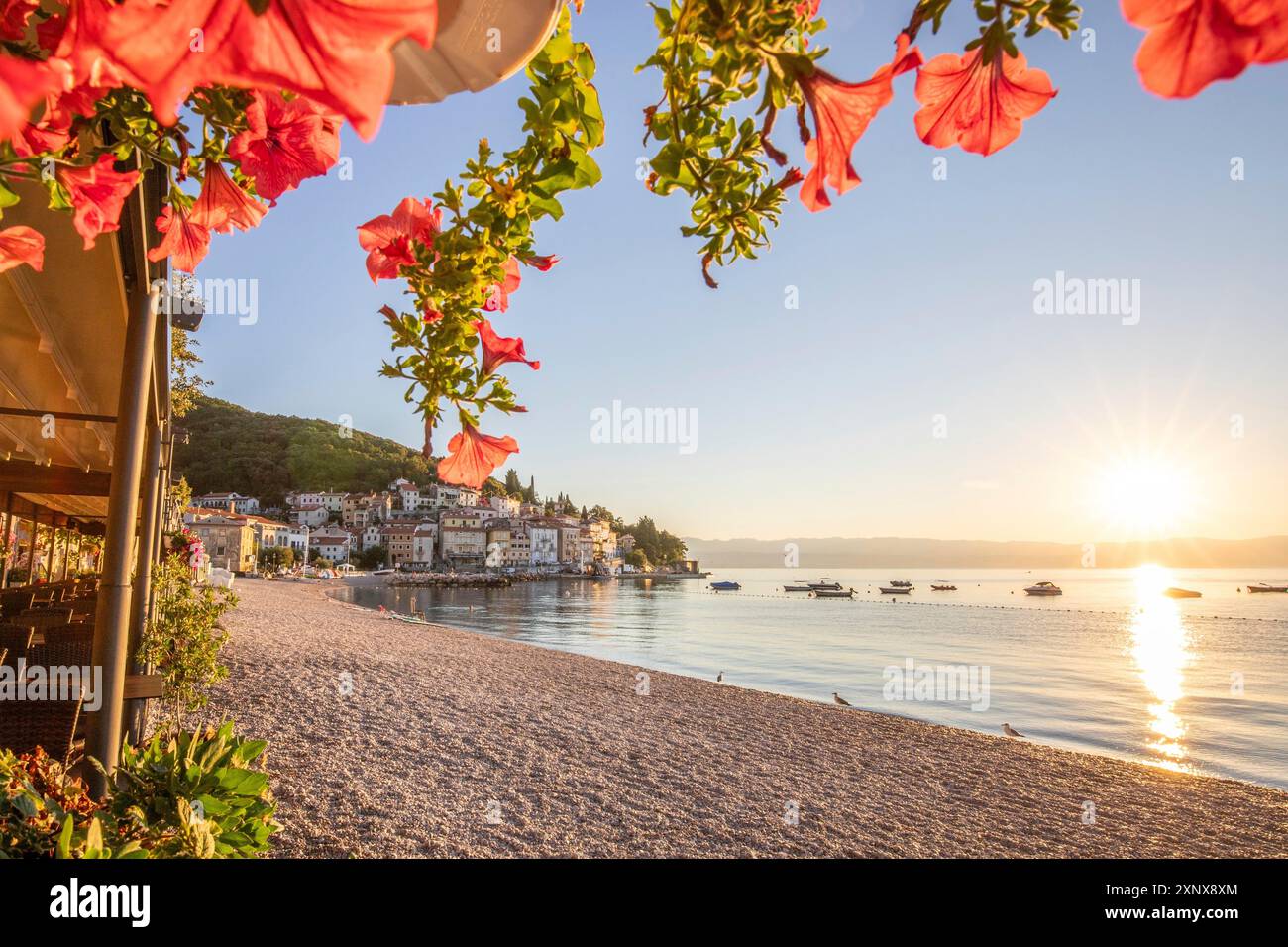 Beautiful historic skyline of a village on the Mediterranean, taken in the morning at sunrise on the beach and by the sea. Dreamlike harbour Stock Photo