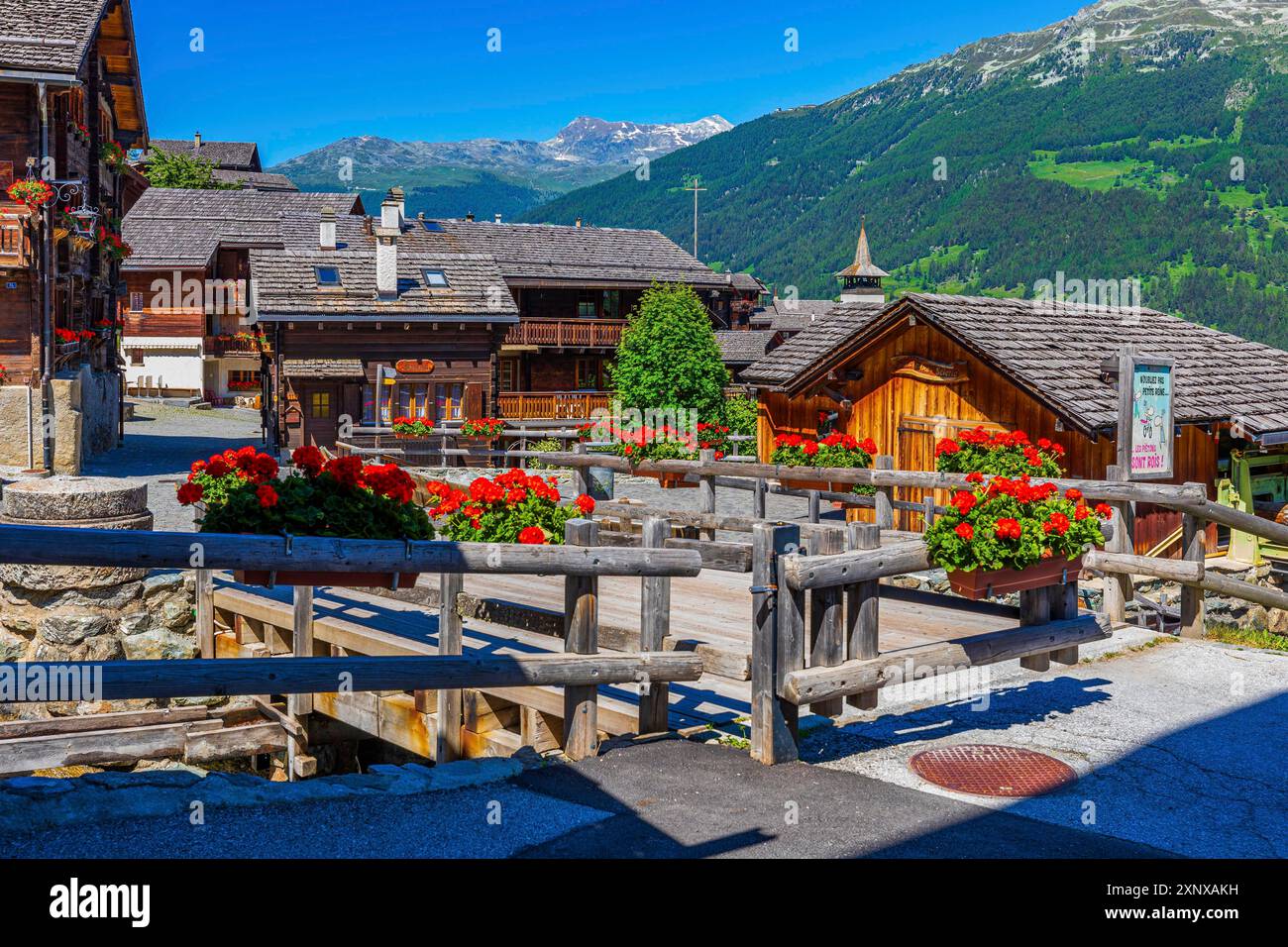 Old wooden houses with wooden shingle roofs and flower boxes in the historic centre of Grimentz, Val d'Anniviers, Valais Alps, Canton Valais Stock Photo