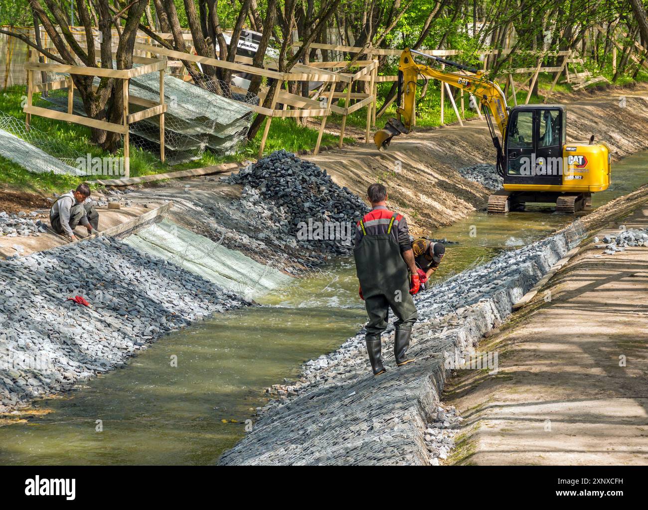 Moscow, Russia - May 12, 2023: Formation of canal banks using gabions ...