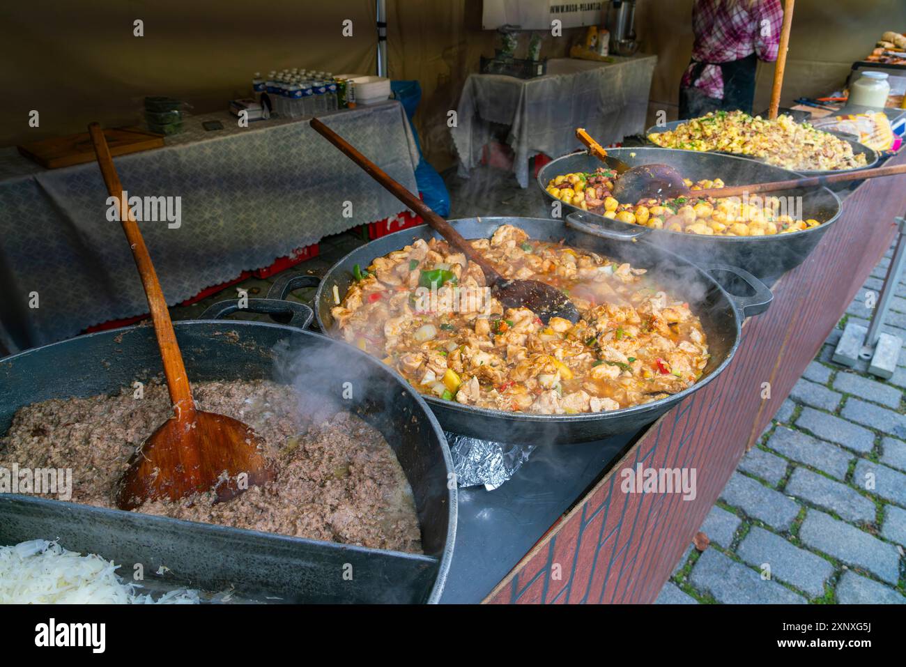 Different types of meals in big saucepans on display at farmers market on Vltava riverside near Palackeho namesti, Prague, Czech Republic Czechia, Eur Stock Photo