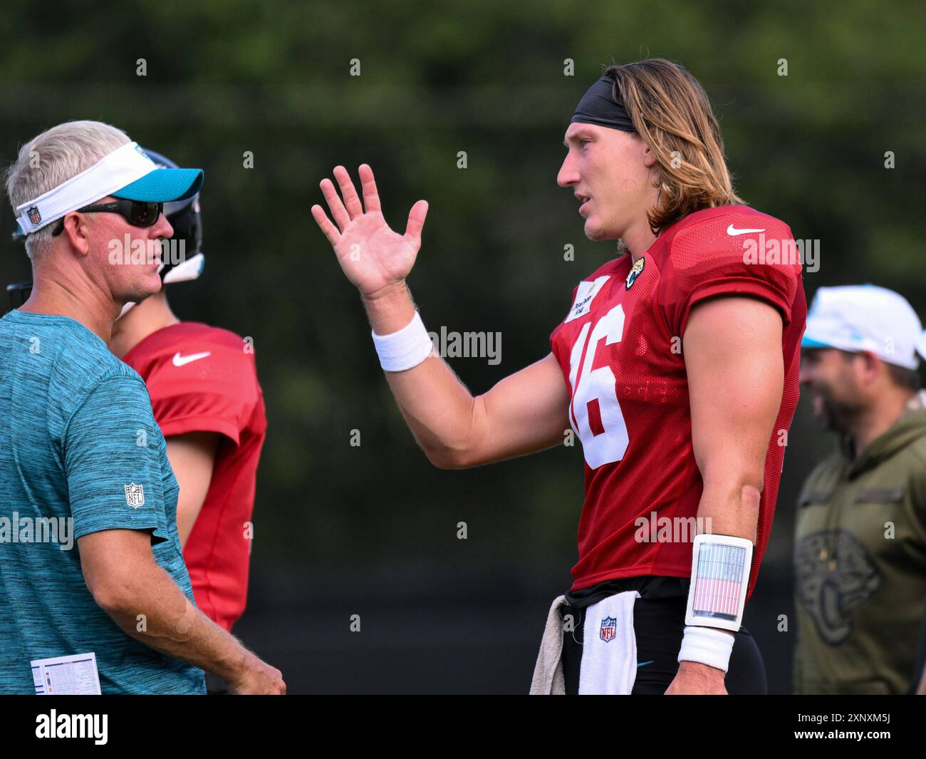 Trevor Romeo August 2, 2024: Jaguars quarterback Trevor Lawerence (16) talks with QB ...