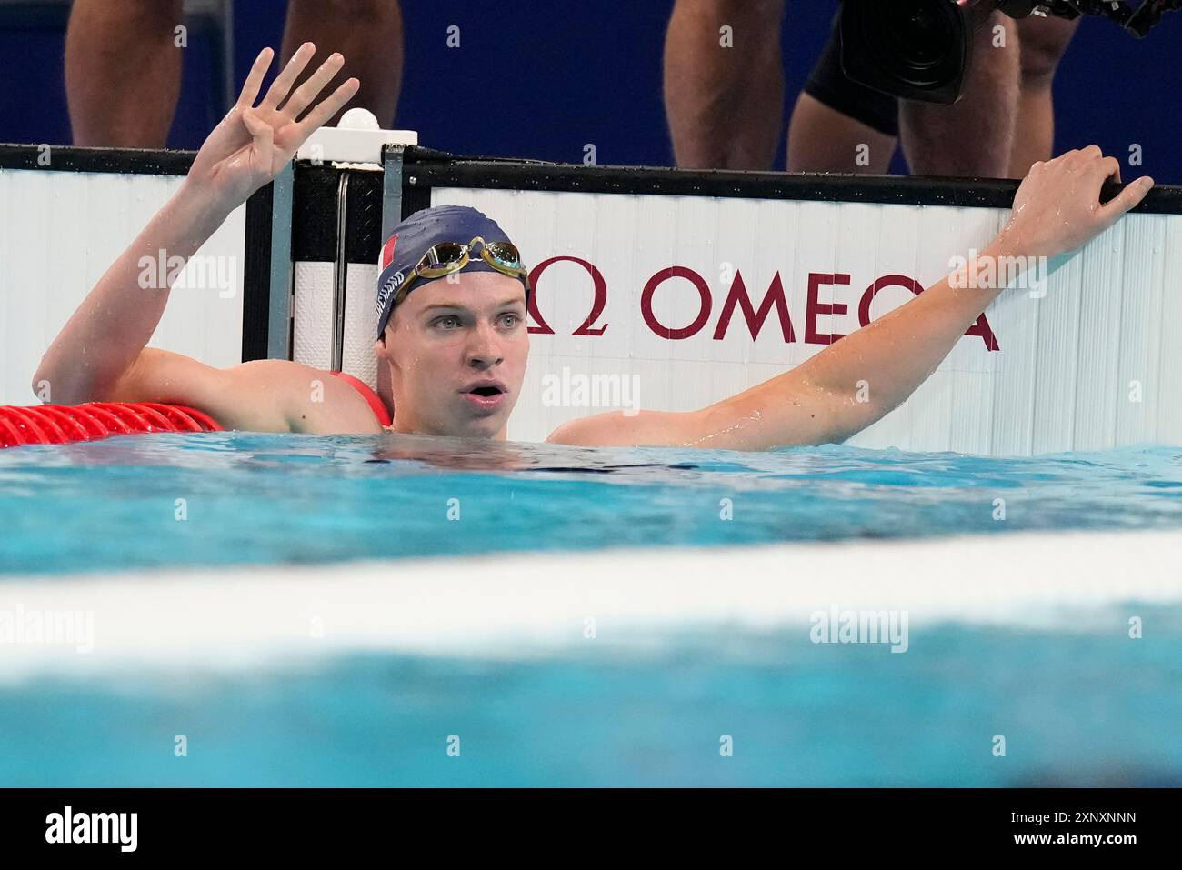 Leon Marchand of France, celebrates after winning the men's 200-meter