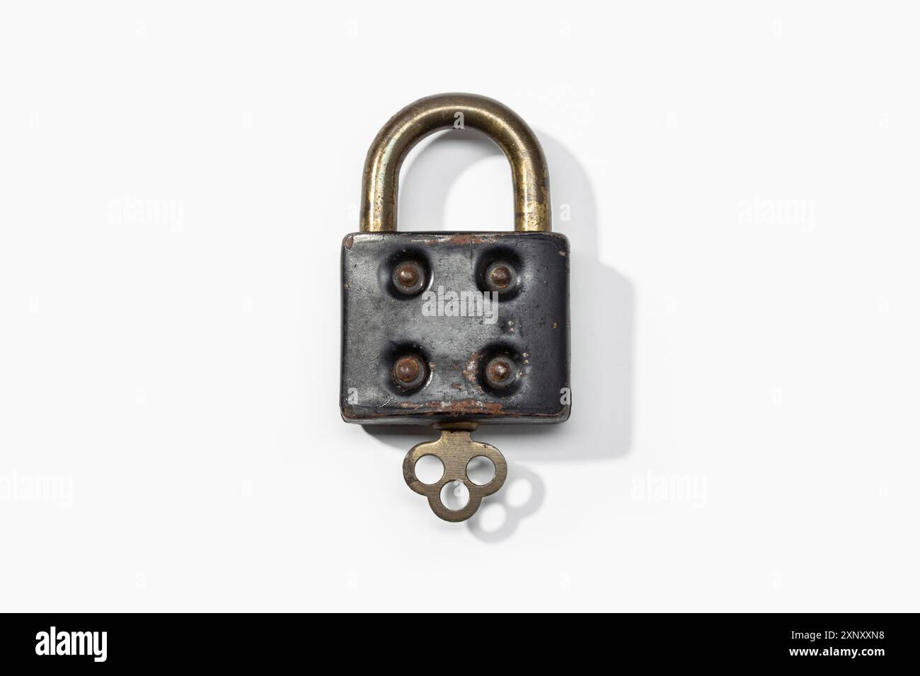 Antique padlock isolated on white background. Closed concept Stock Photo