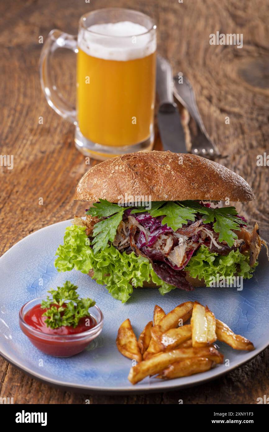 Pulled pork in a bun with beer Stock Photo