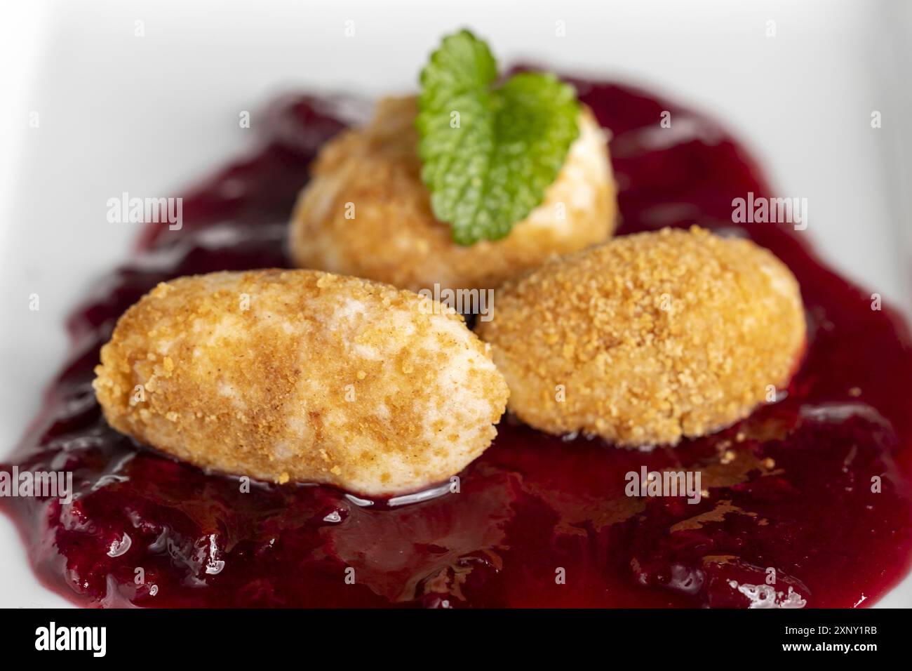 Austrian pot dumplings on plum sauce Stock Photo