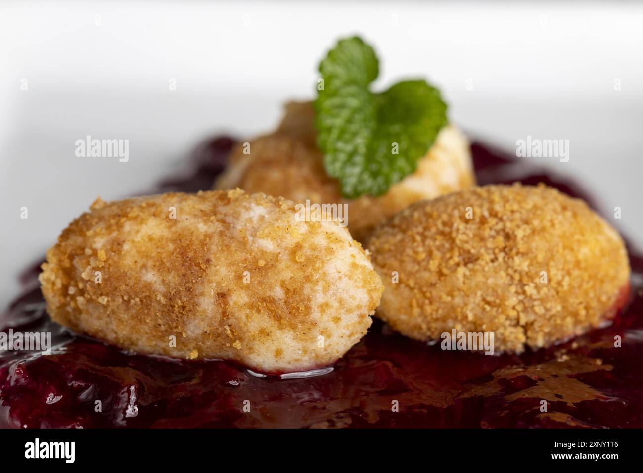 Austrian pot dumplings on plum sauce Stock Photo