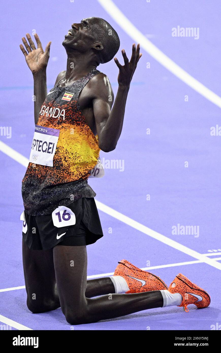 Paris, France. 02nd Aug, 2024. Olympic champion, gold medal winner Uganda's Joshua Chepteguei celebrates after winning the Men's 10000m final of the athletics competition at the Paris 2024 Olympic Games, on Friday 02 August 2024 in Paris, France. The Games of the XXXIII Olympiad are taking place in Paris from 26 July to 11 August. The Belgian delegation counts 165 athletes competing in 21 sports. BELGA PHOTO JASPER JACOBS Credit: Belga News Agency/Alamy Live News Stock Photo