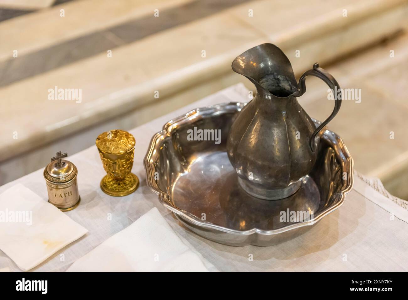 Ampoule with water and oil for the catholic baptism Stock Photo