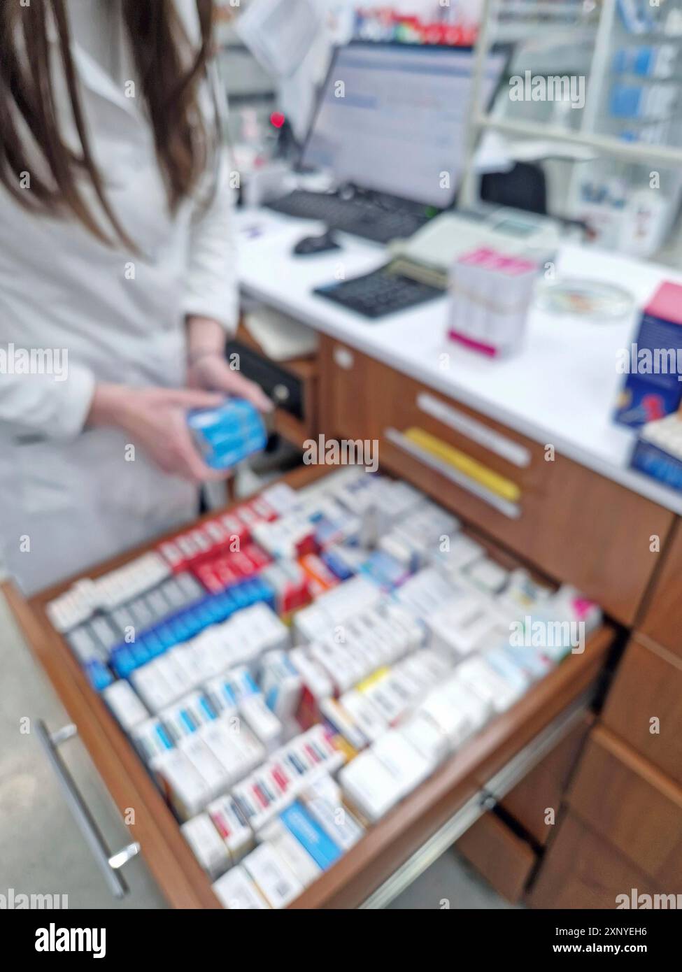 Blurred view female pharmacist hi-res stock photography and images - Alamy