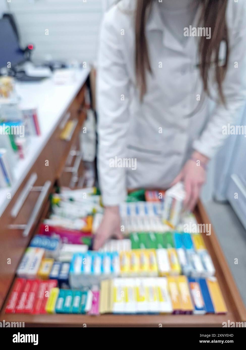 Blurred view female pharmacist hi-res stock photography and images - Alamy