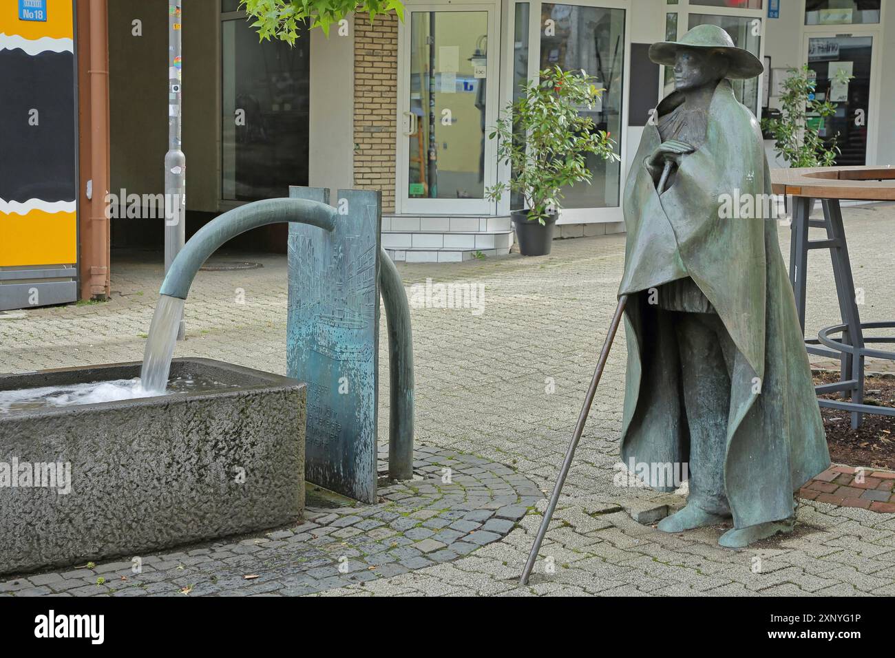 Sculpture Shepherd's Fountain Herd of Cows with Shepherd by Wolfgang Kreutter 1986, bronze, shepherd with staff, fountain, water jet, Alte Stock Photo