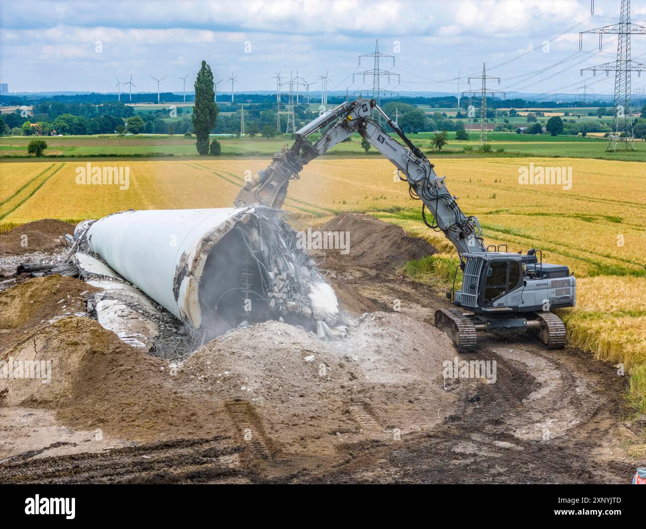 Demolished tower of a 20 year old wind turbine, in the Werl wind farm ...