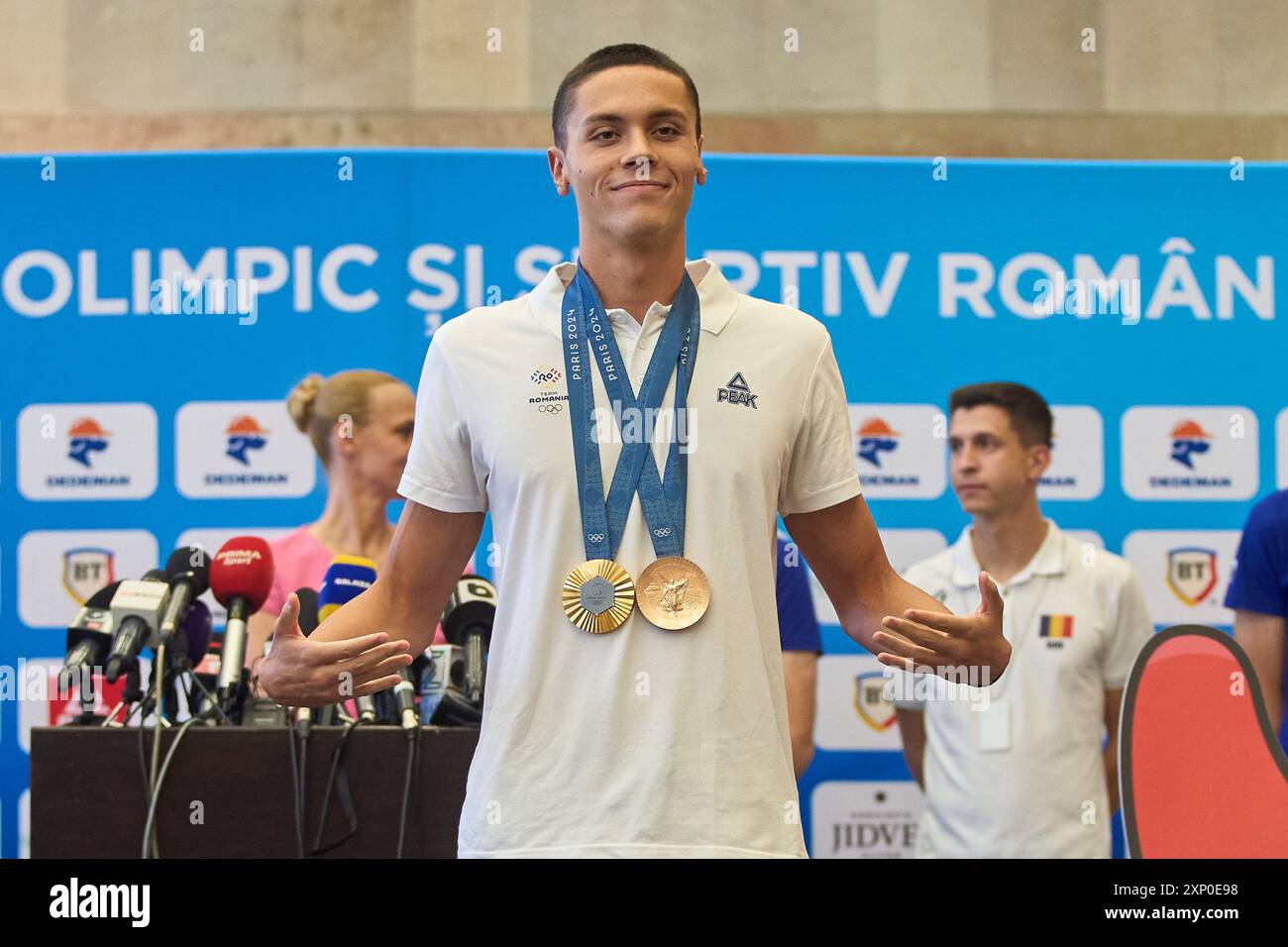 Otopeni, Romania. 2nd Aug, 2024 Romanian Olympic gold medalist swimmer David Popovici returns