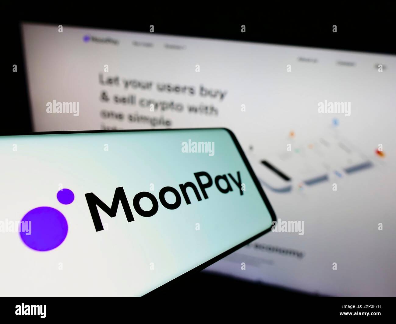 Smartphone with logo of crypto company Moon Pay PTE Limited (MoonPay) on  screen in front of website. Focus on center-left of phone display Stock  Photo - Alamy