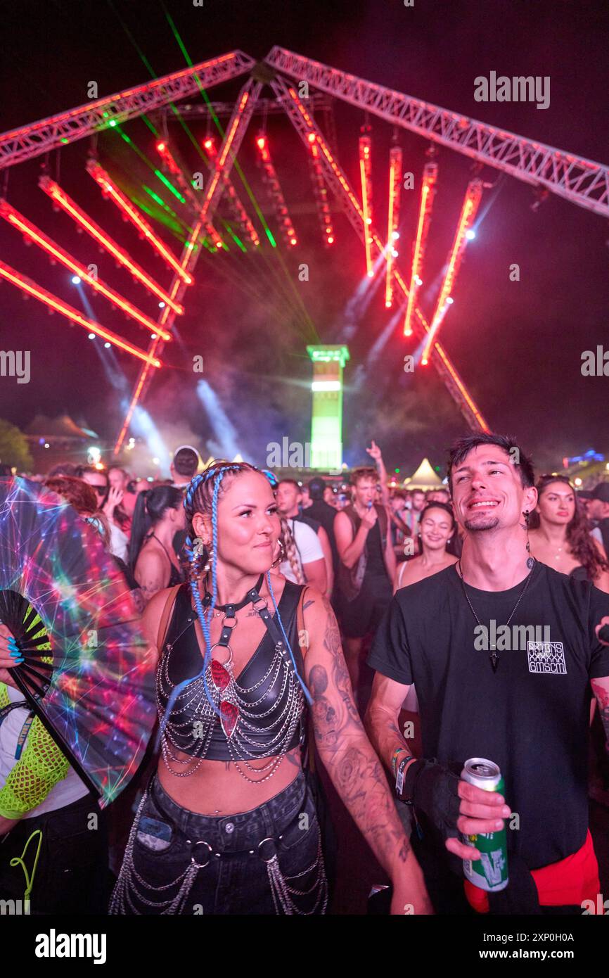 Kastellaun, Germany. 02nd Aug, 2024. The front row of thousands of ravers dances in front of the open-air stage at the Nature One techno festival on the former US missile base in Pydna. For the 28th time, electronic music is booming in the Hunsrück, this year until August 4. Credit: Thomas Frey/dpa/Alamy Live News Stock Photo