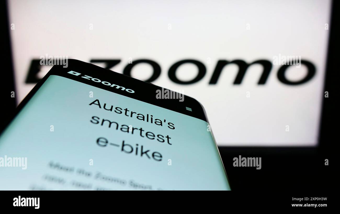 Stuttgart, Germany, 02-26-2022: Smartphone with website of electric bicycle company Bolt Bikes (Zoomo) on screen in front of business logo. Focus on Stock Photo
