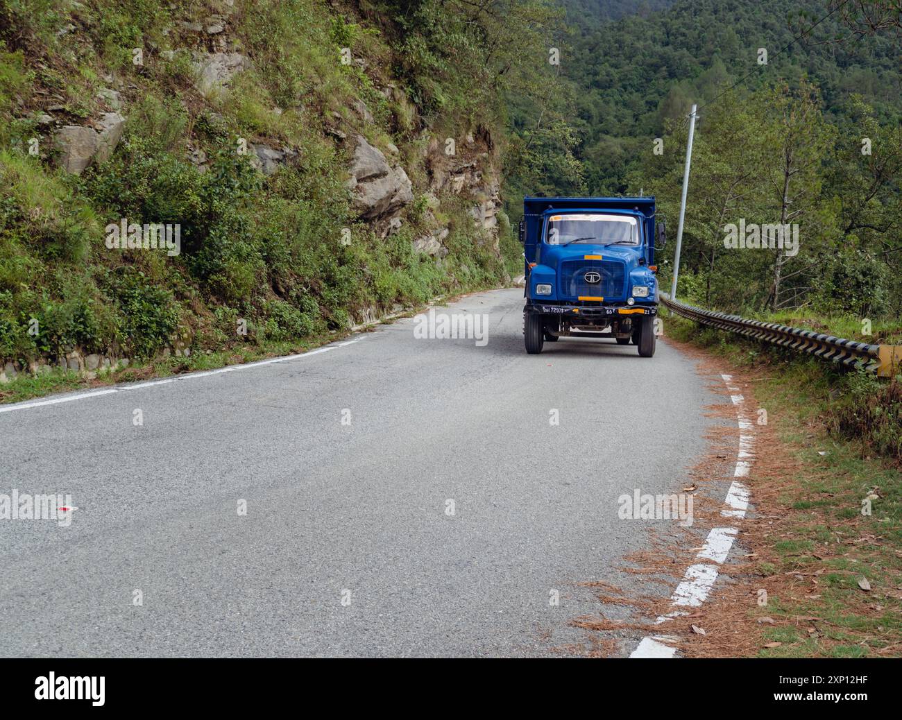 Aug2nd2024, Uttarakhand India. An old blue Tata truck transporting goods in the upper Himalayan region of Uttarakhand to its remote villages, where su Stock Photo